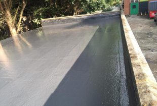 after-shot of a flat roof with newly installed lead roofing by 5 Star Roofcare on a property in Surrey.