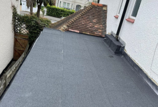 5 Star Roofcare installed a black roofing membrane on a flat roof to provide durability and protection.
