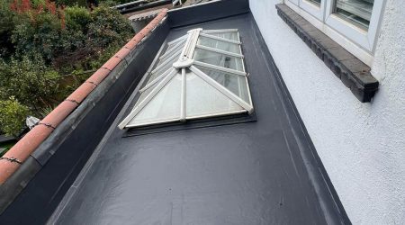 5 Star Roofcare - lead flashing added to a flat roof with a pitched skylight